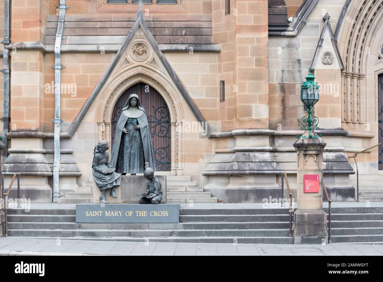 A statue of St Mary of the Cross (Mary Helen Mackillop) on the Western side (College Street) of Saint Mary's Cathedral in Sydney, Australia Stock Photo