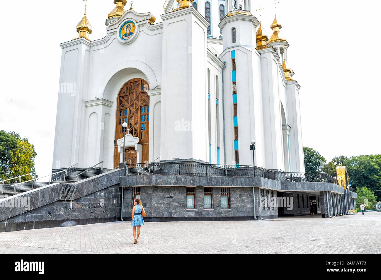 Rivne, Ukraine - July 3, 2018: Soborna Lypnya street in Rovno city in Ukraine in summer and woman people by St Basil Cathedral UOC-KP Stock Photo