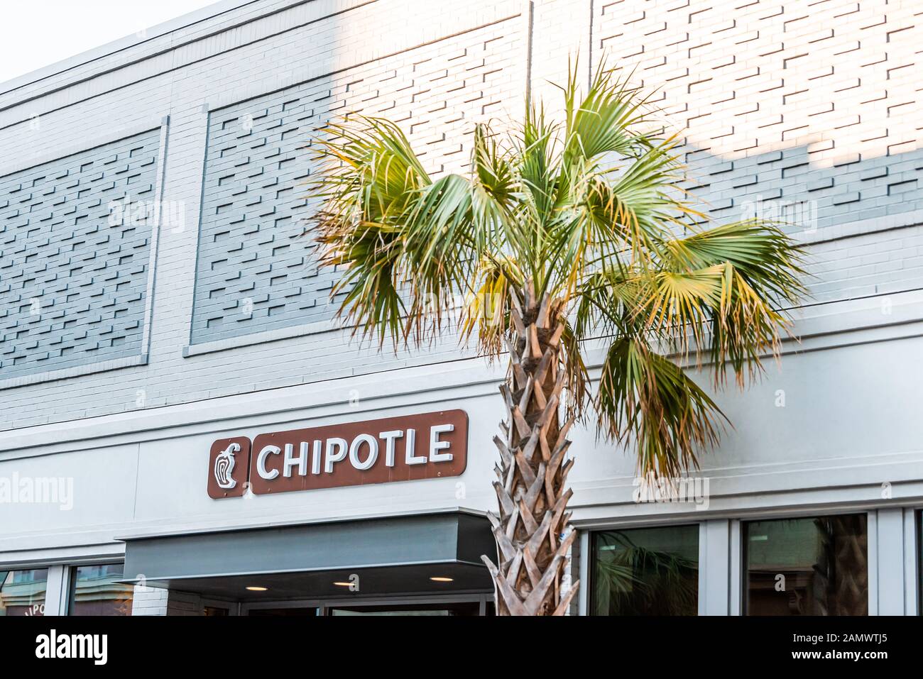 Charleston, USA - May 12, 2018: Downtown city King street in South Carolina in southern town with colorful building and sign for Chipotle restaurant Stock Photo