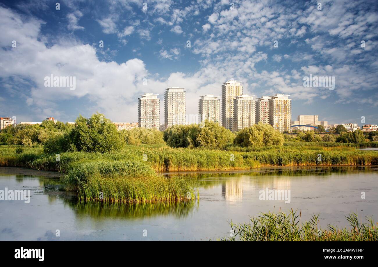 Vacaresti Nature Park - Delta between the blocks with skyscrapers in the background, in Bucharest, Romania. Stock Photo
