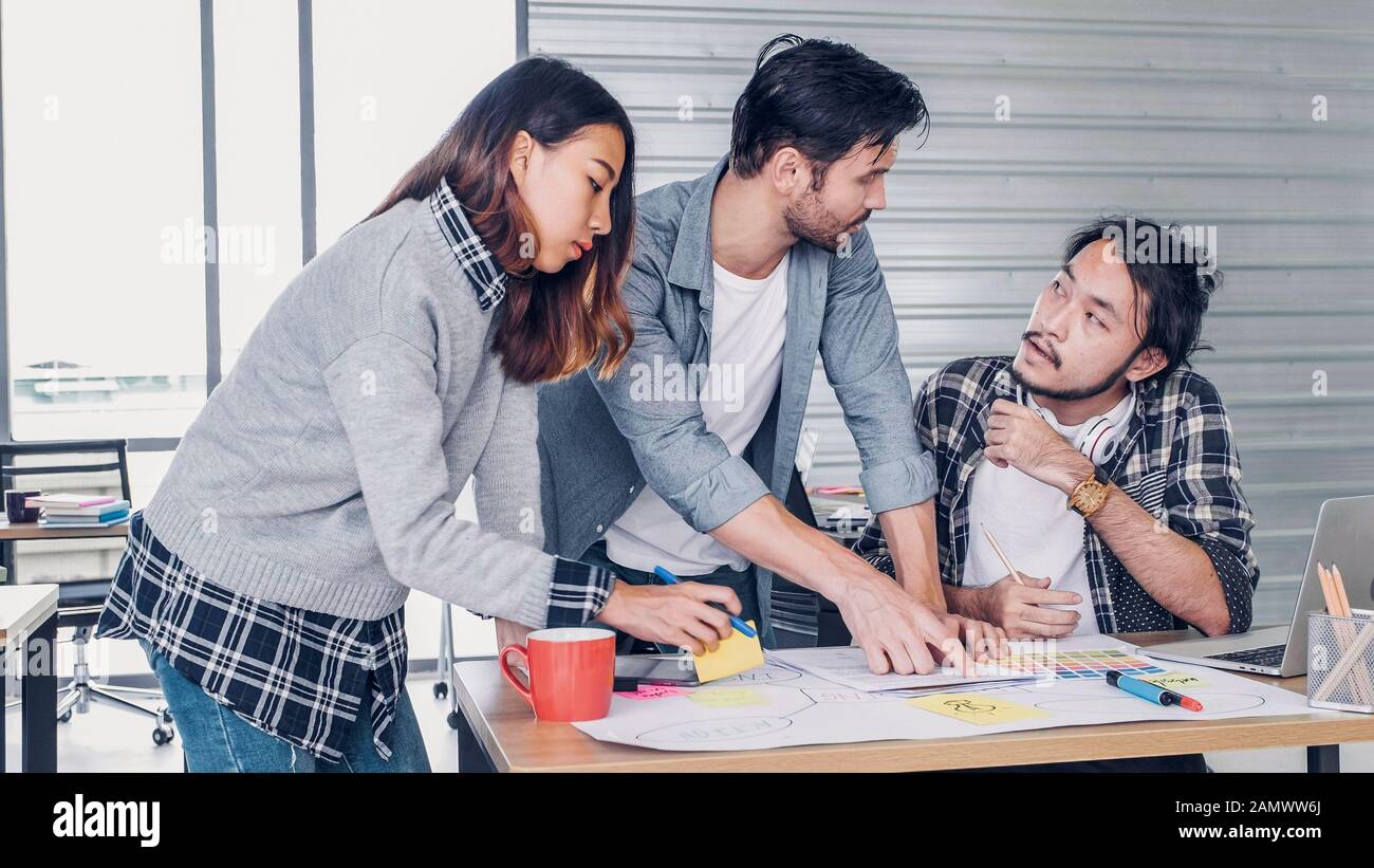 creative designer team argument at casual meeting table and walk out from meeting in modern office.tea,m conflict concept Stock Photo
