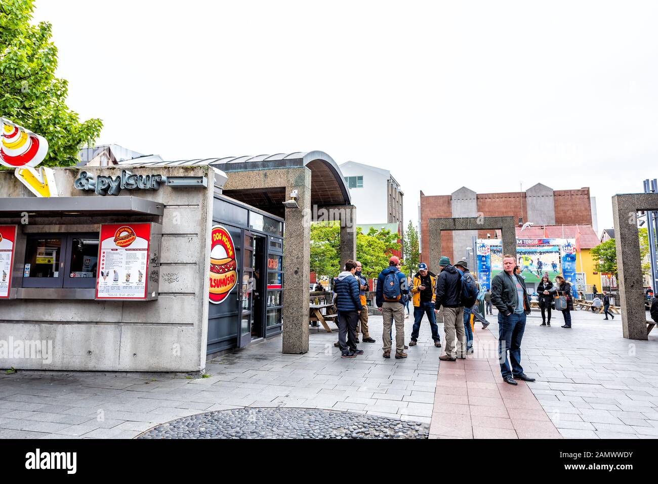 Reykjavik, Iceland - June 19, 2018: Ingolfur Ingolfstorg Square with signs for HM Torgid people watching world cup FIFA and restaurant Stock Photo