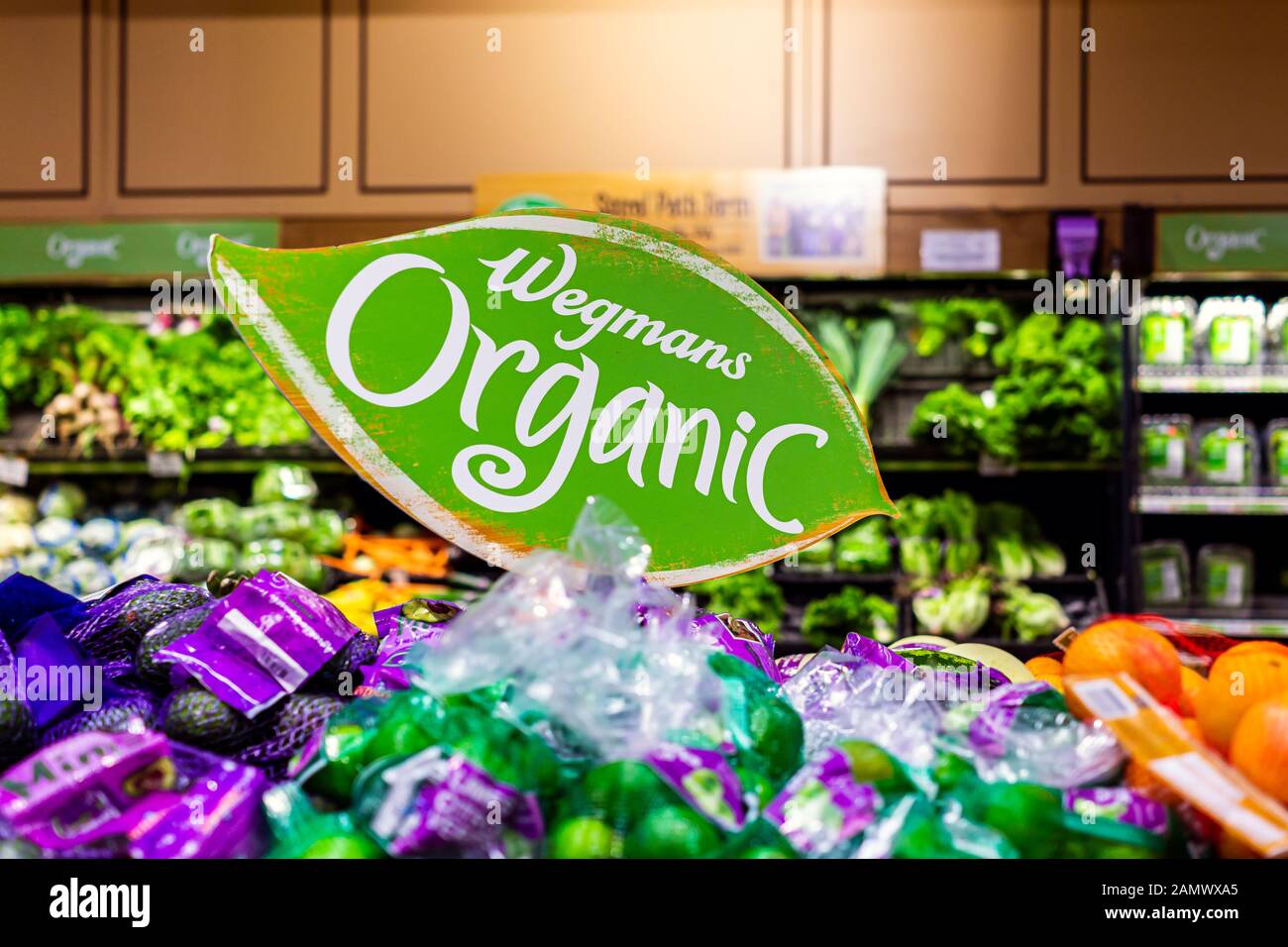Fairfax, USA - December 5, 2019: Wegmans grocery store interior with organic sign text in produce aisle with vegetables fruits Stock Photo