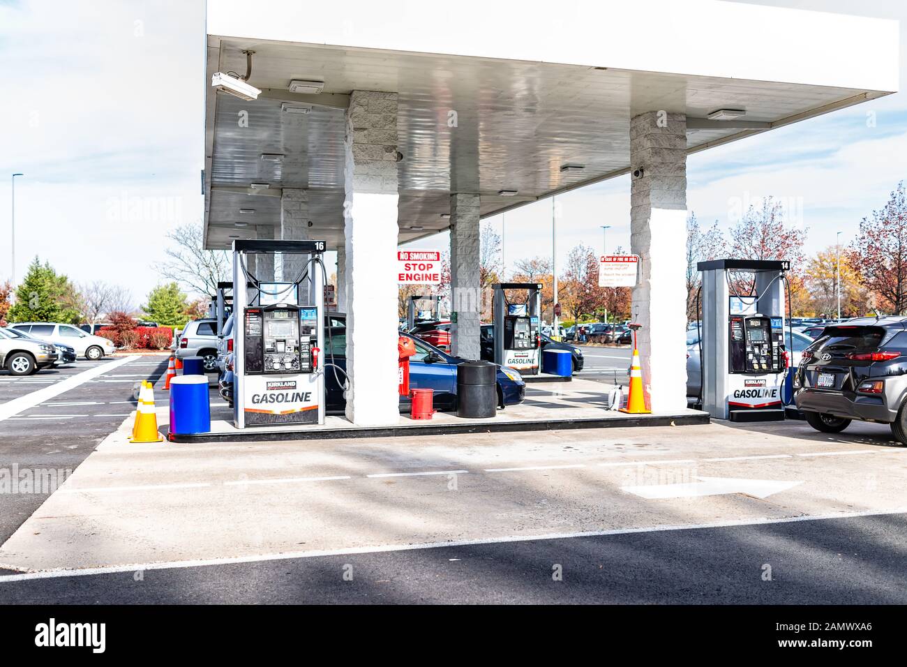 Sterling, USA - November 21, 2019: Cars filling up vehicles with gas gasoline petroleum at Costco store in Virginia Stock Photo