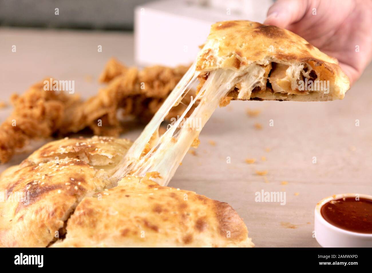 Crispy Fried Chicken Stuffed Naan with Mozzarella Cheese pulling by