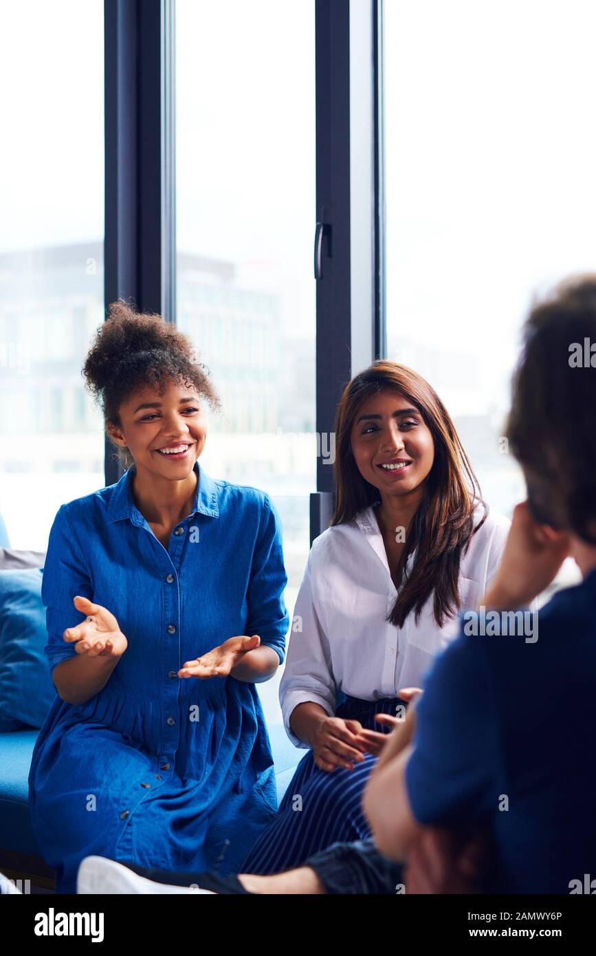 Young adults coworkers exchanging their ideas Stock Photo Alamy