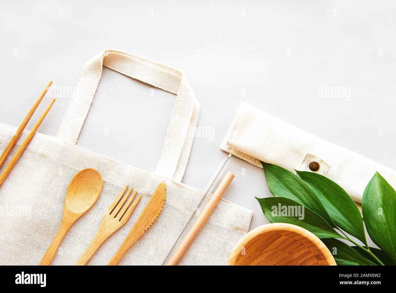 Eco-friendly Kitchen Utensils, Paper Disposable Tableware And Mesh Bag.  Wooden Cutlery And Shopping Bag On A Beige Background. Sustainable  Lifestyle. Zero Waste Concept Stock Photo, Picture and Royalty Free Image.  Image 188223475.