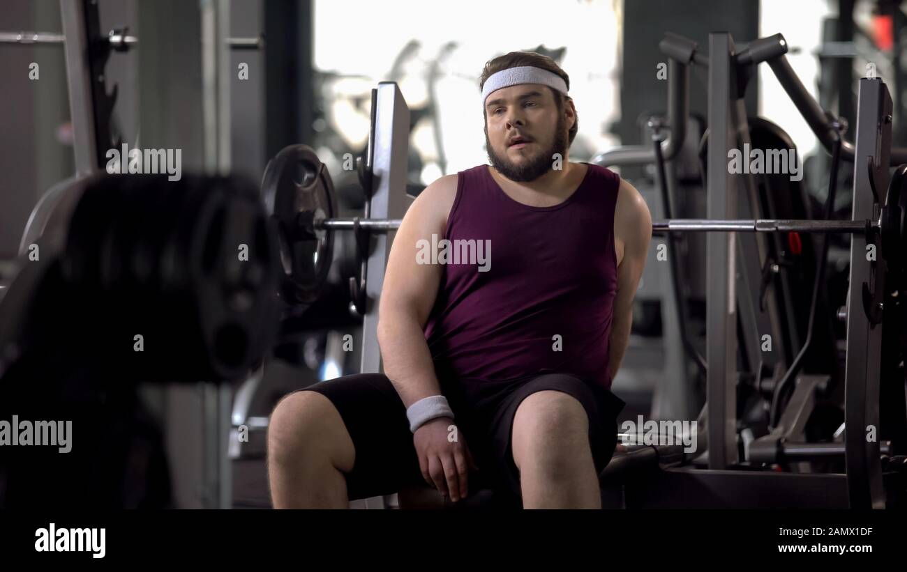 Tired fat man having rest after workout exercise strength of muscles training Stock Photo Alamy