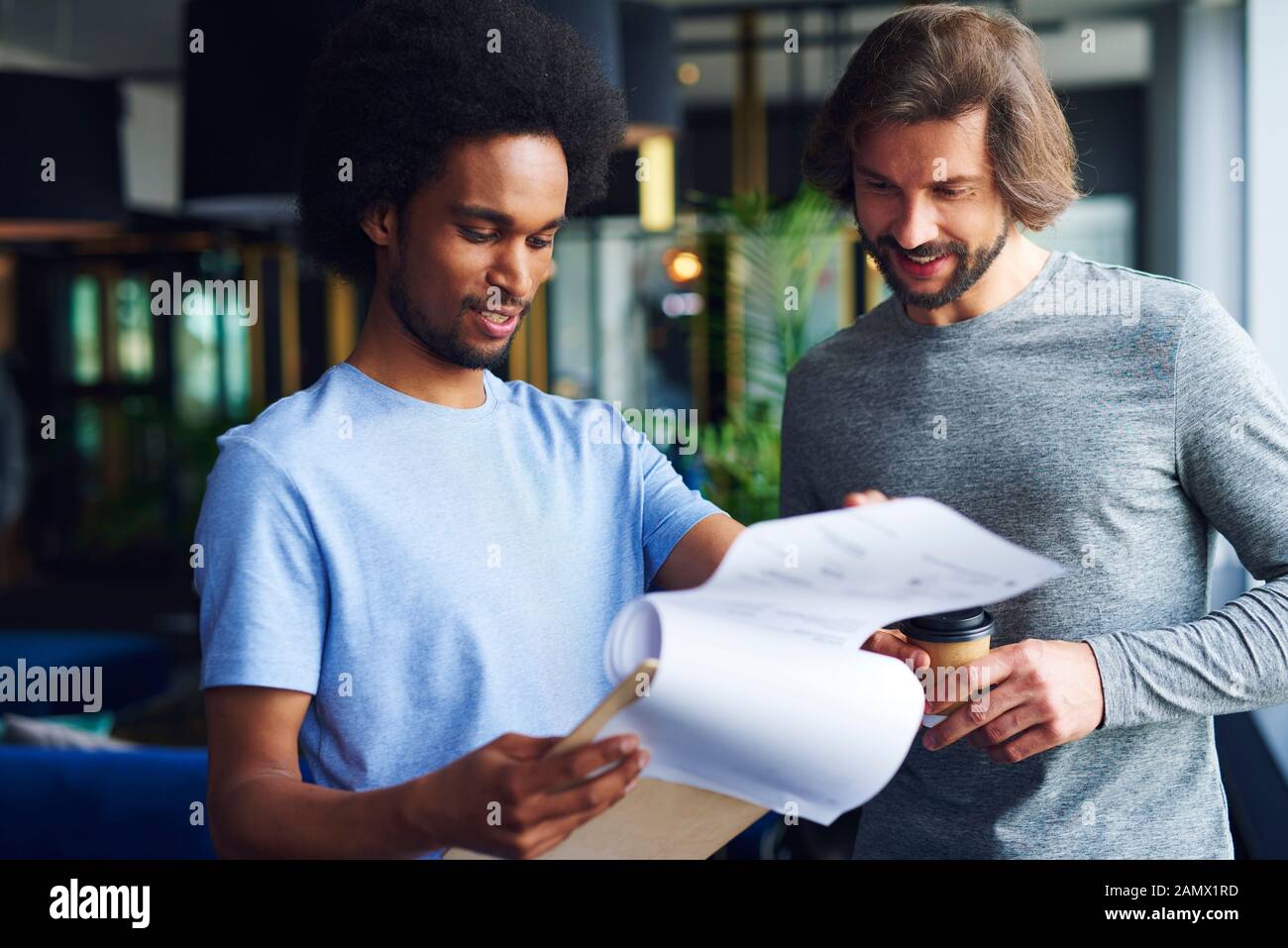 Young coworkers analyzing important documents Stock Photo