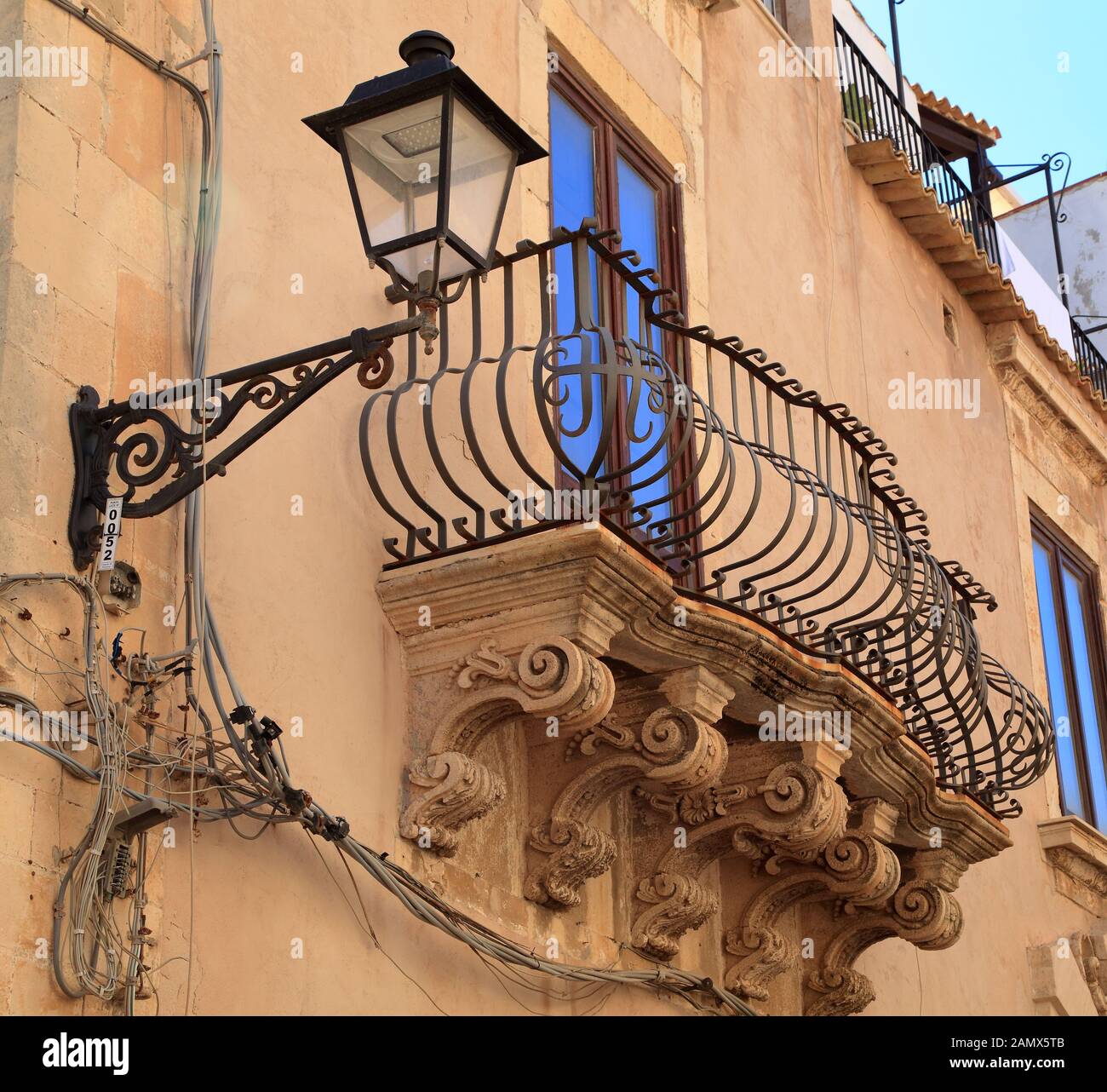 Roman corbels. Sculptured balcony brackets. Baroque architecture in Sicily Stock Photo