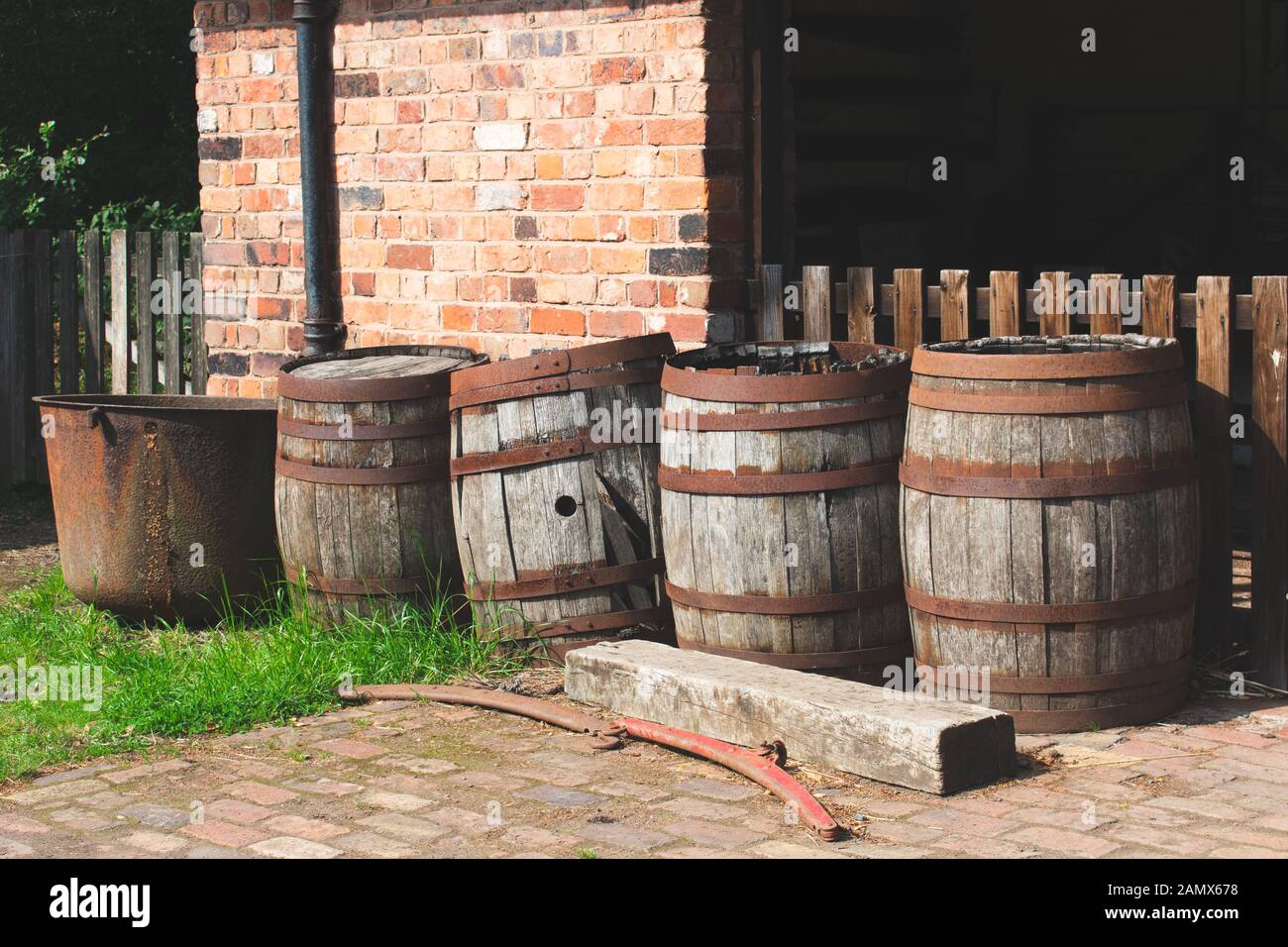 Vintage wooden barrels, left outside in an old yard Stock Photo Alamy