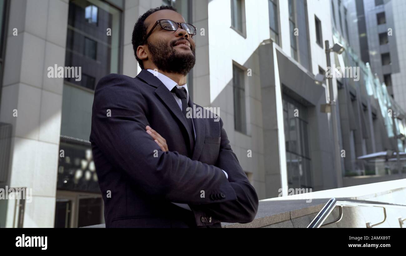 Businessman standing near office building hi-res stock photography and ...
