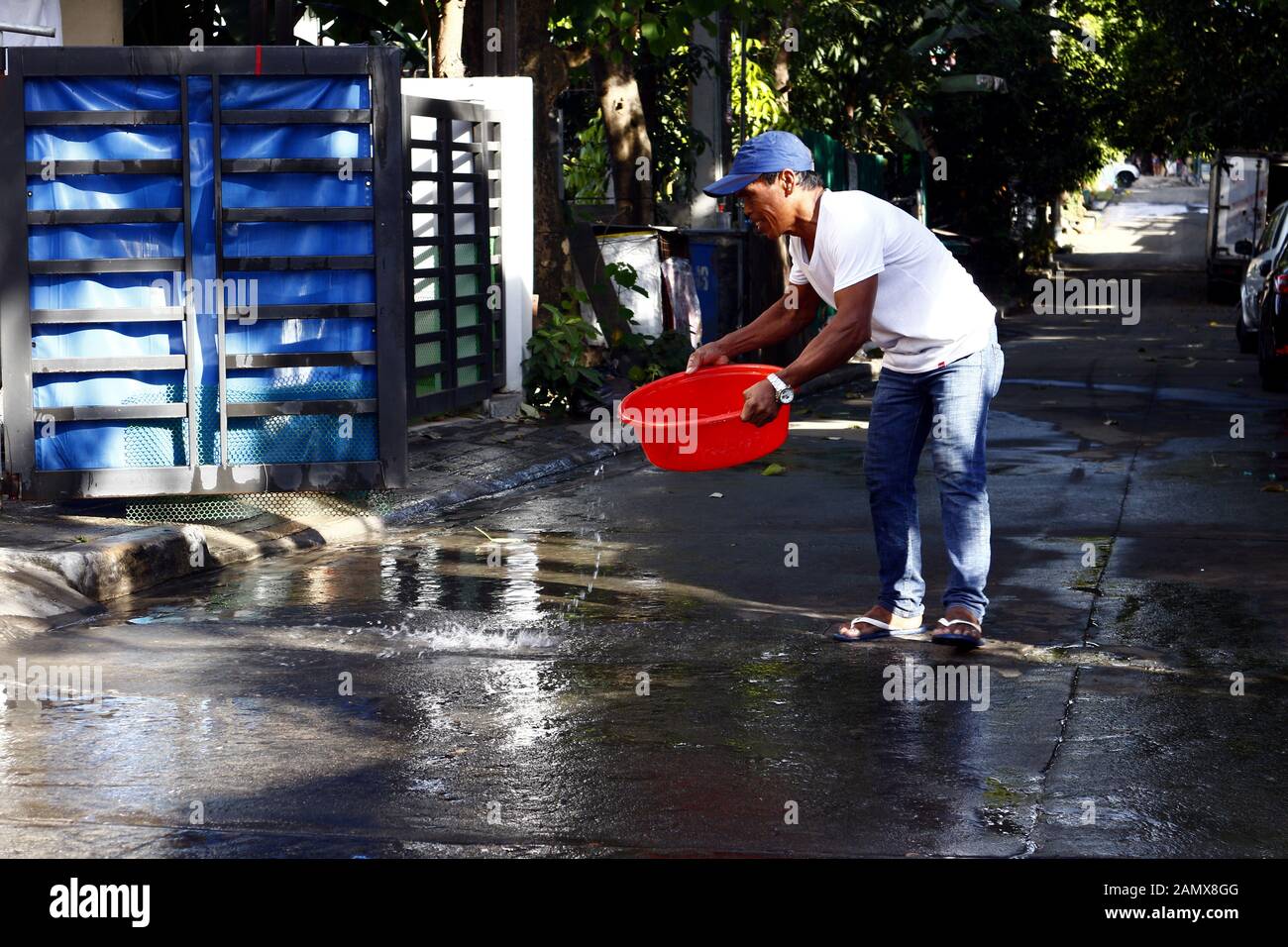 Antipolo City, Philippines January 13, 2020 Residents clean the