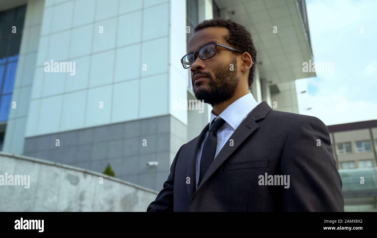 African-American businessman in eyeglasses, treatment blurred vision, eyesight Stock Photo