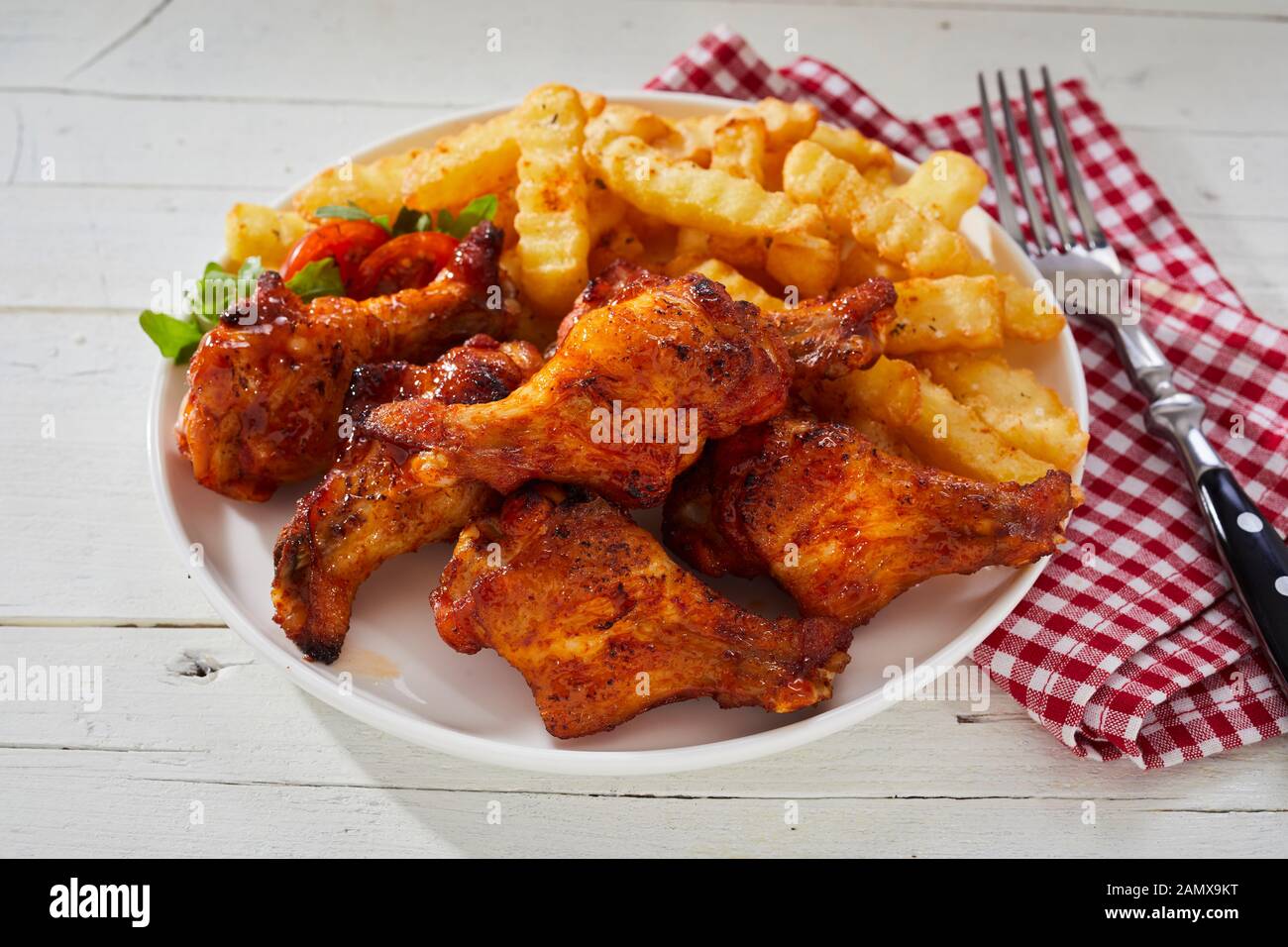 Spicy crumbed chicken wings with French Fries or crinkle cut oven baked