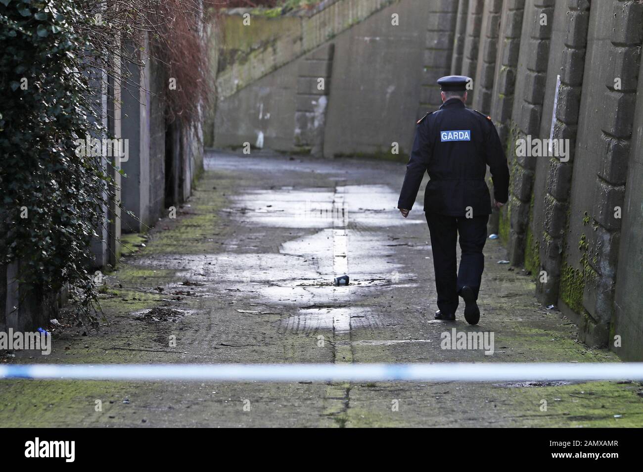 Gardai at the scene on Trinity Terrace in the Drumcondra area of Dublin where human remains, believed to be linked to the disappearance of a 17-year-old boy from Co Louth, have been found in a burnt out car. Gardai are awaiting DNA results to see if human limbs found in Coolock on Monday also belong to the missing teenager. Stock Photo