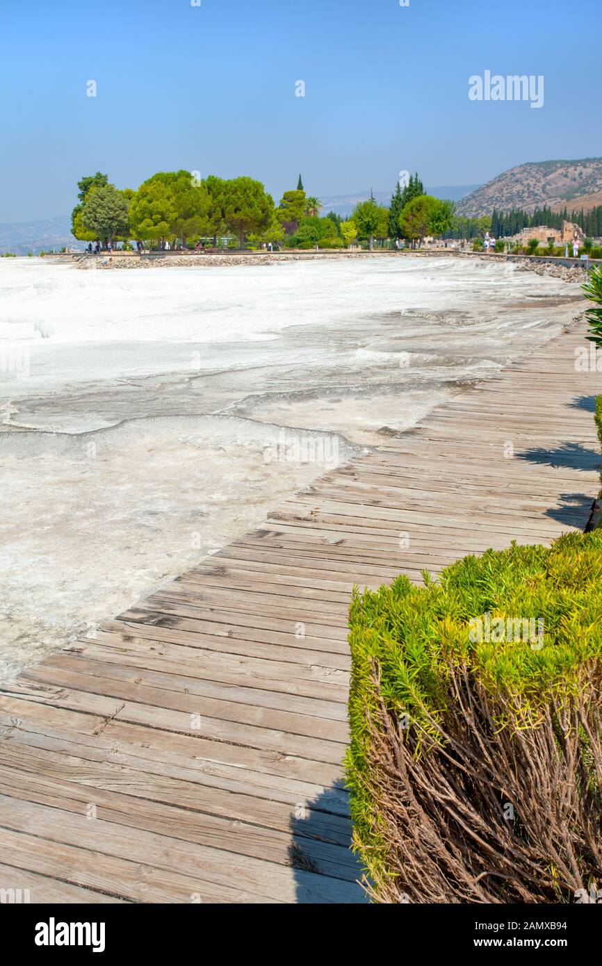View of the Pamukkale travertine from a wooden floor for the access of tourists. Stock Photo