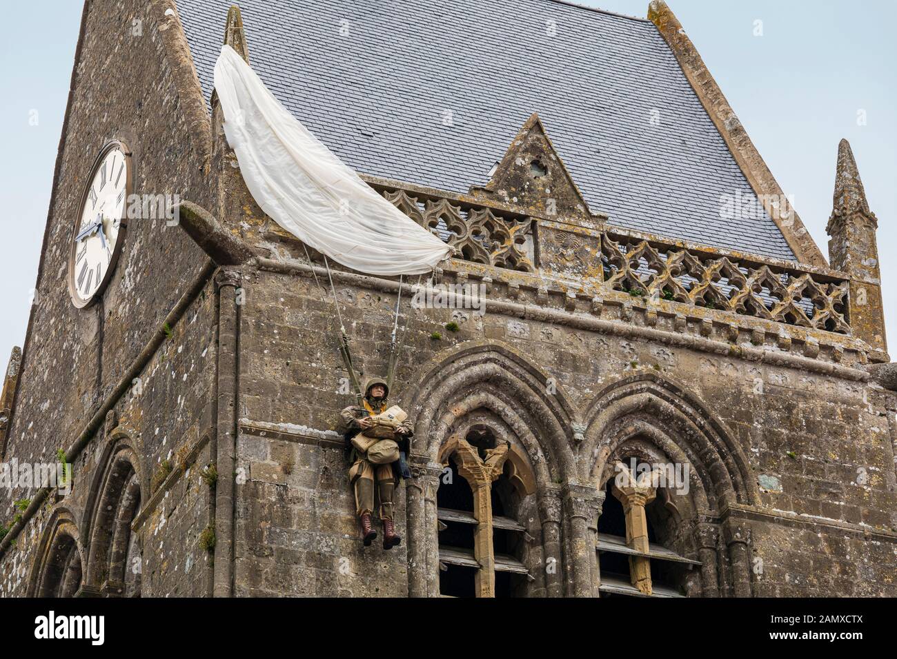 Dummy of paratrooper John Steele who got stuck on the top of the church of Sainte-Mère-Église in Normandy during the allied invasion in World War II Stock Photo