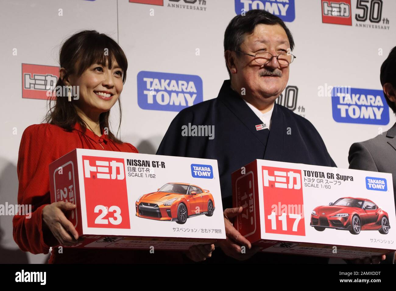 January 15 Tokyo Japan Japanese Toymaker Tomy Chairman Kantaro Tomiyama R Smiles With Freelance Announcer Maya Kobayashi L As They Attend The 50th Anniversary Event Of Tomy S Minicar Brand Tomica