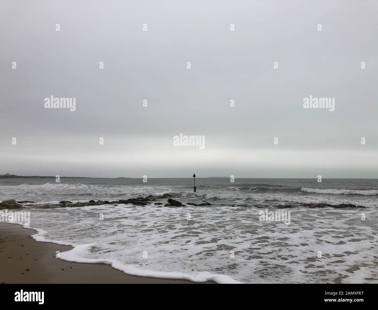 The blue flaged beach of Sandbanks, showing how the sea and rain during