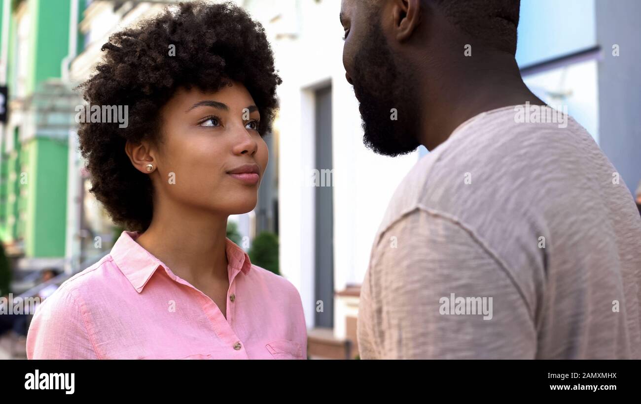 Man looking woman after street hi-res stock photography and images - Alamy