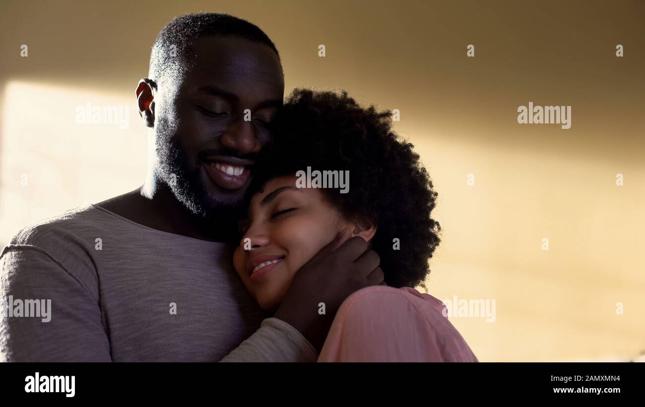 Husband hugging wife, family connection, harmonious relations ...