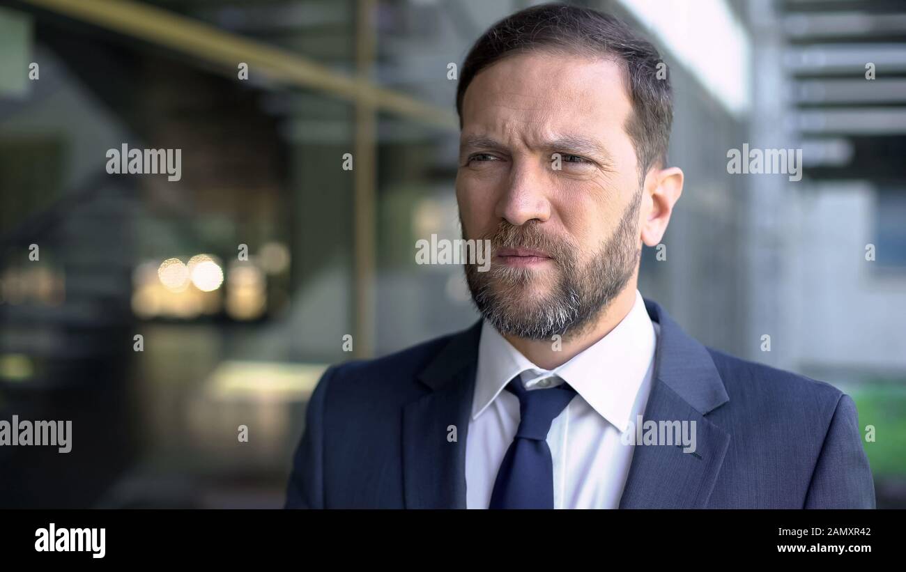 Worried office worker close up, thinking over important deal, stressed lifestyle Stock Photo