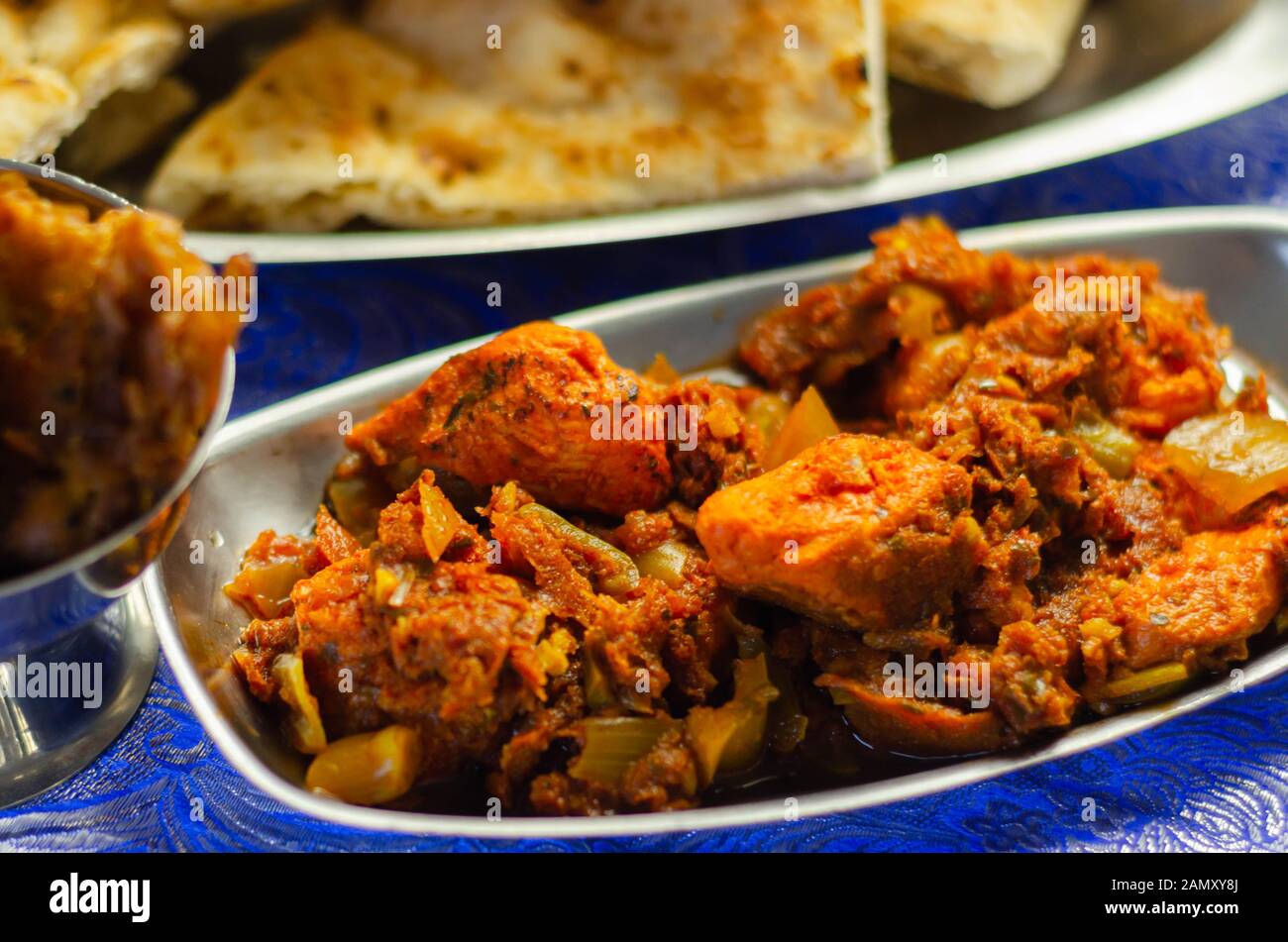 Chicken jalfrezi and chicken curry with various rice and onion Bhajis