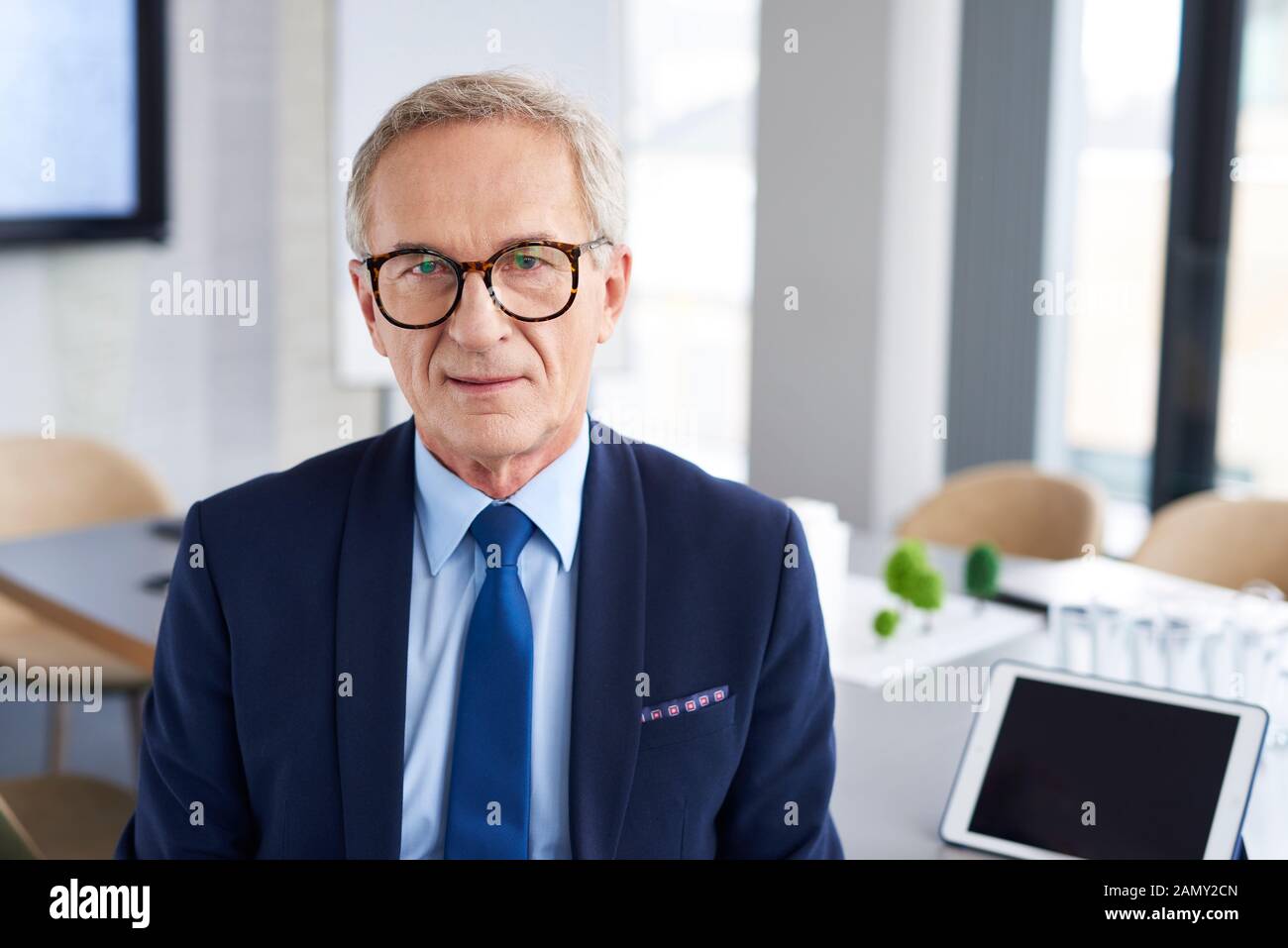 Portrait of confident businessman in conference room Stock Photo