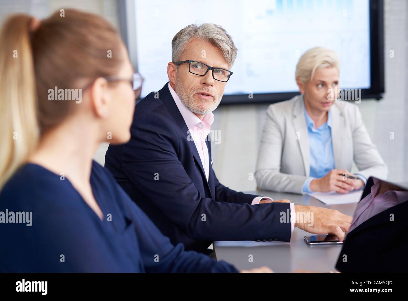 Confident leader convincing about his opinion during conference Stock Photo