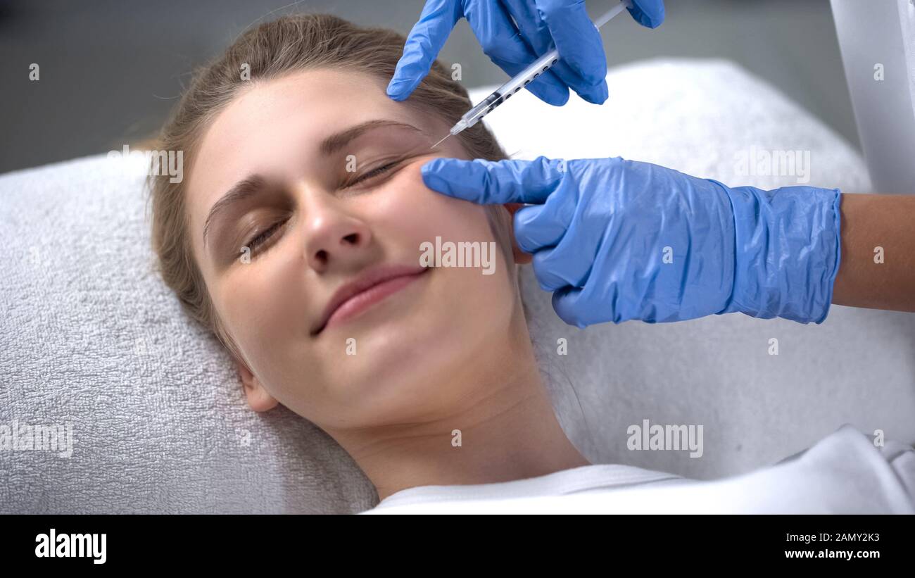 Woman struggling with aging, injections of beauty smoothing wrinkles