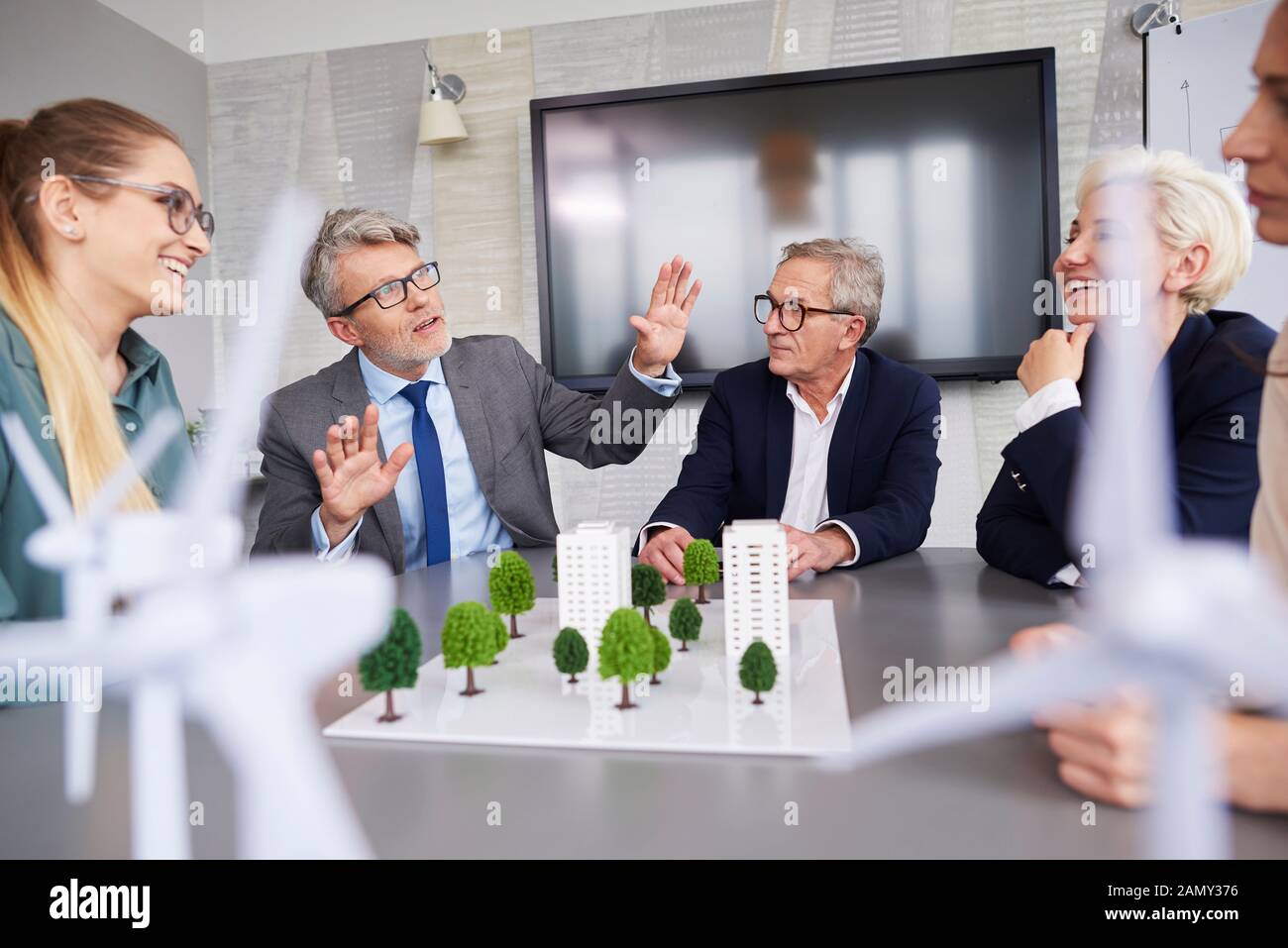 Senior businessman leading during conference Stock Photo