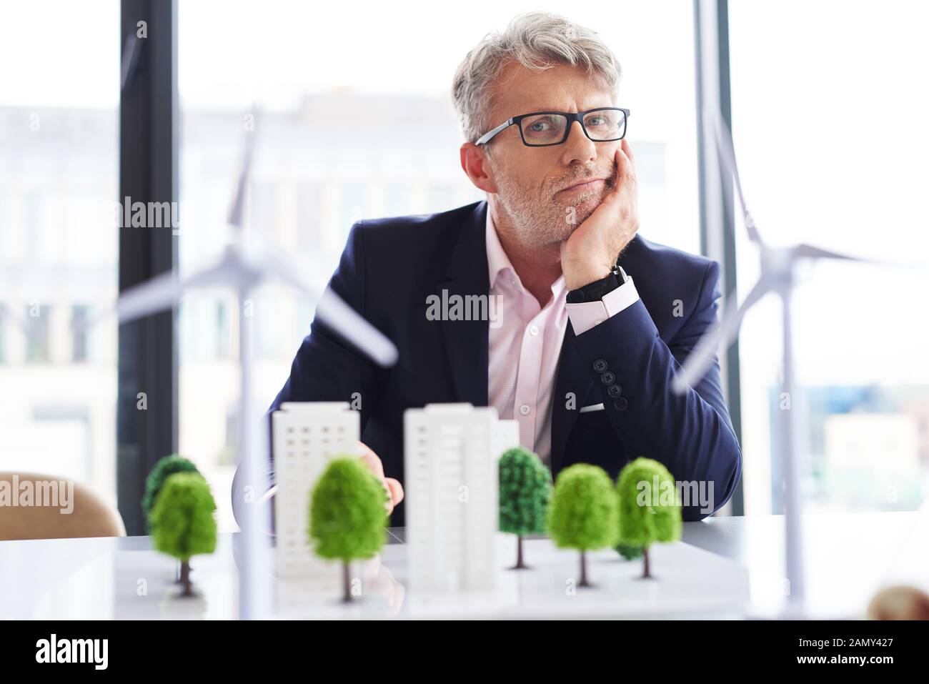 Portrait of tired businessman at work Stock Photo