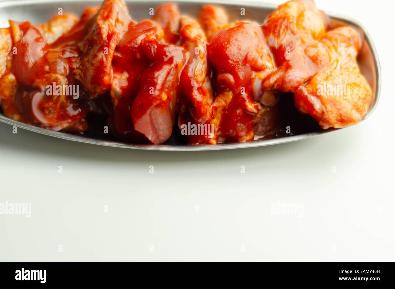 Raw and fresh chicken wings in a Chinese marinade, ready for grilling Stock Photo Alamy
