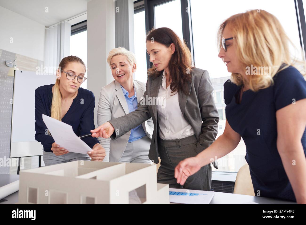 Team of businesswomen having consultations about strategy Stock Photo