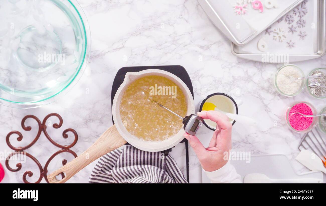Flat lay. Step by step. Caramelizing sugar in a small cooking pot over ...