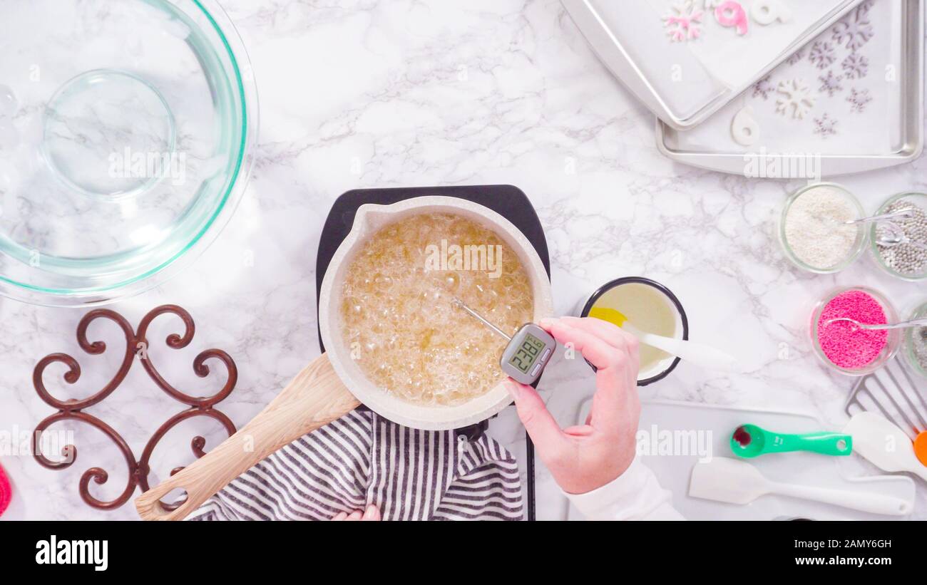 Flat lay. Step by step. Caramelizing sugar in a small cooking pot over ...