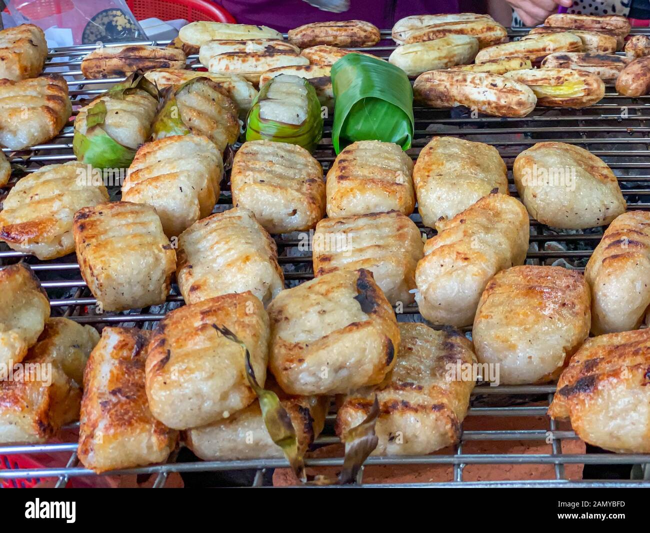 Cambodian grilled sticky rice banana at street food market Stock Photo