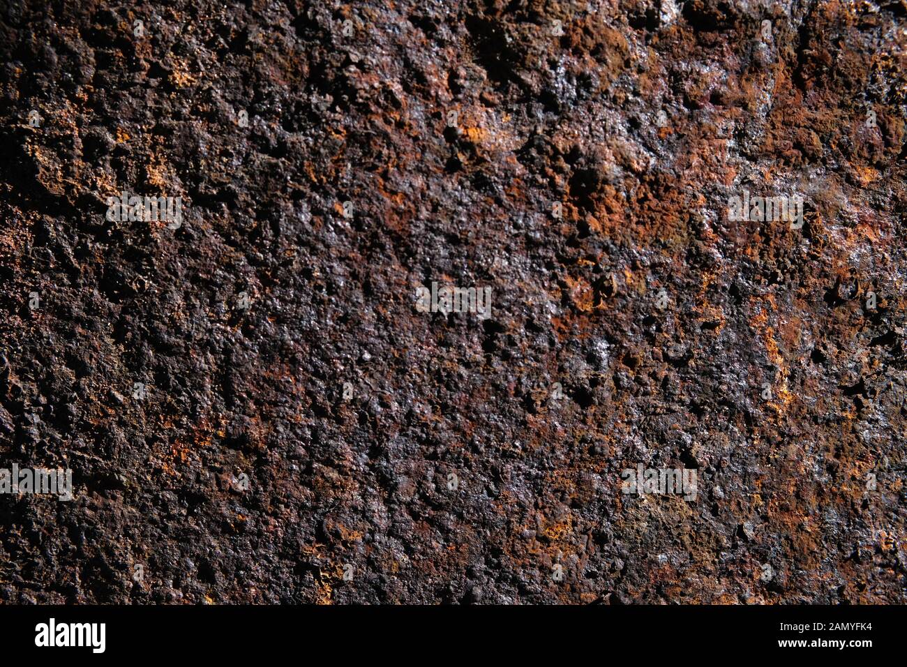 Structure of colourful orange, red and brown hue rusty iron tubes Stock Photo