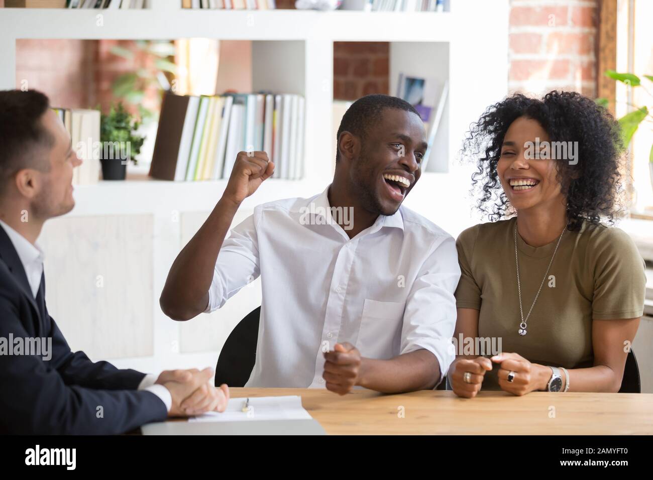 Excited black couple feel hi-res stock photography and images - Alamy