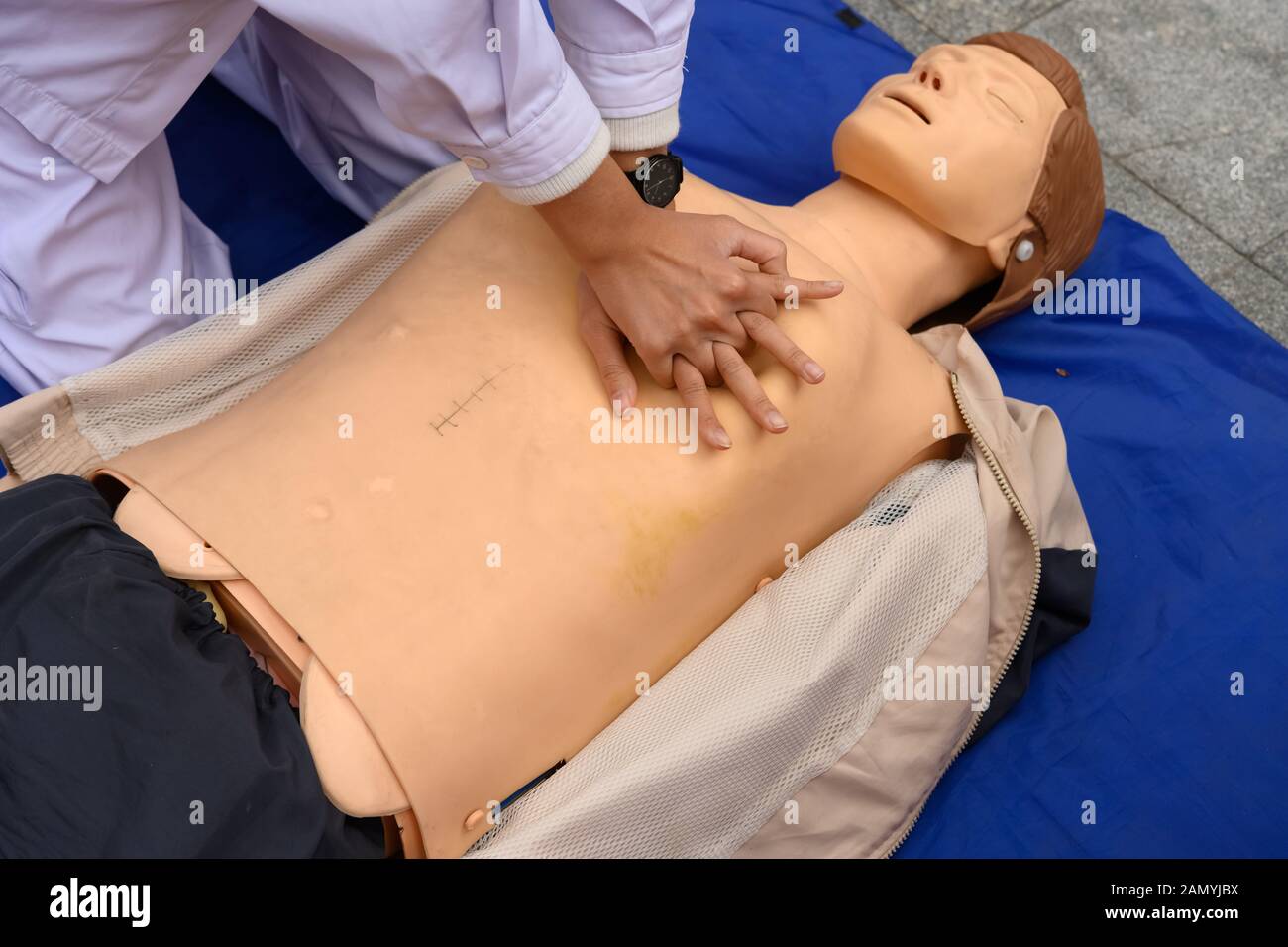 nurse demonstrating cardiopulmonary resuscitation on a dummy human model Stock Photo