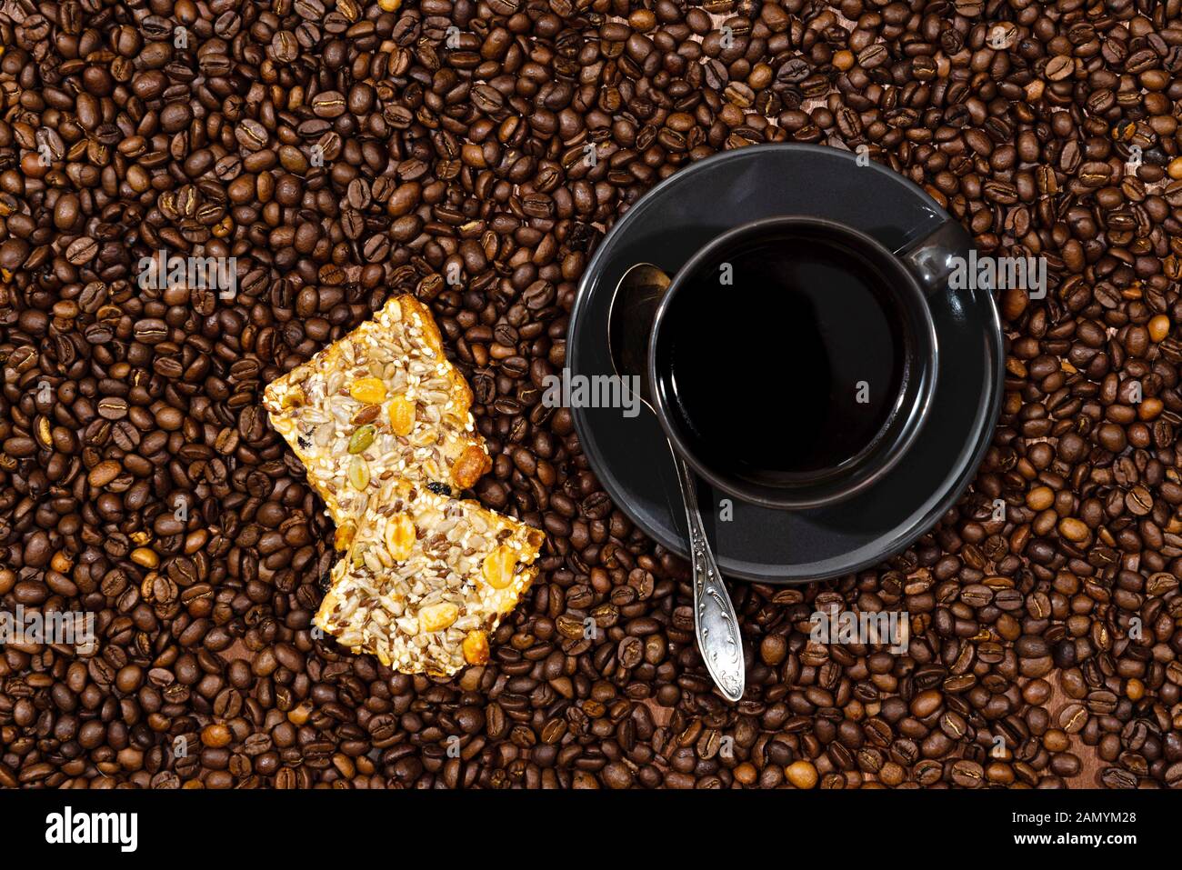 White coffee mug and cookies on the coffee beans background - image Stock Photo