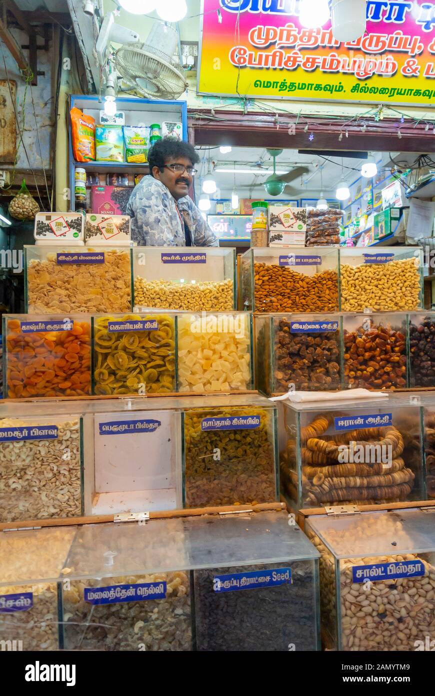 Indian man selling snacks at food market, Madurai, South India Stock Photo