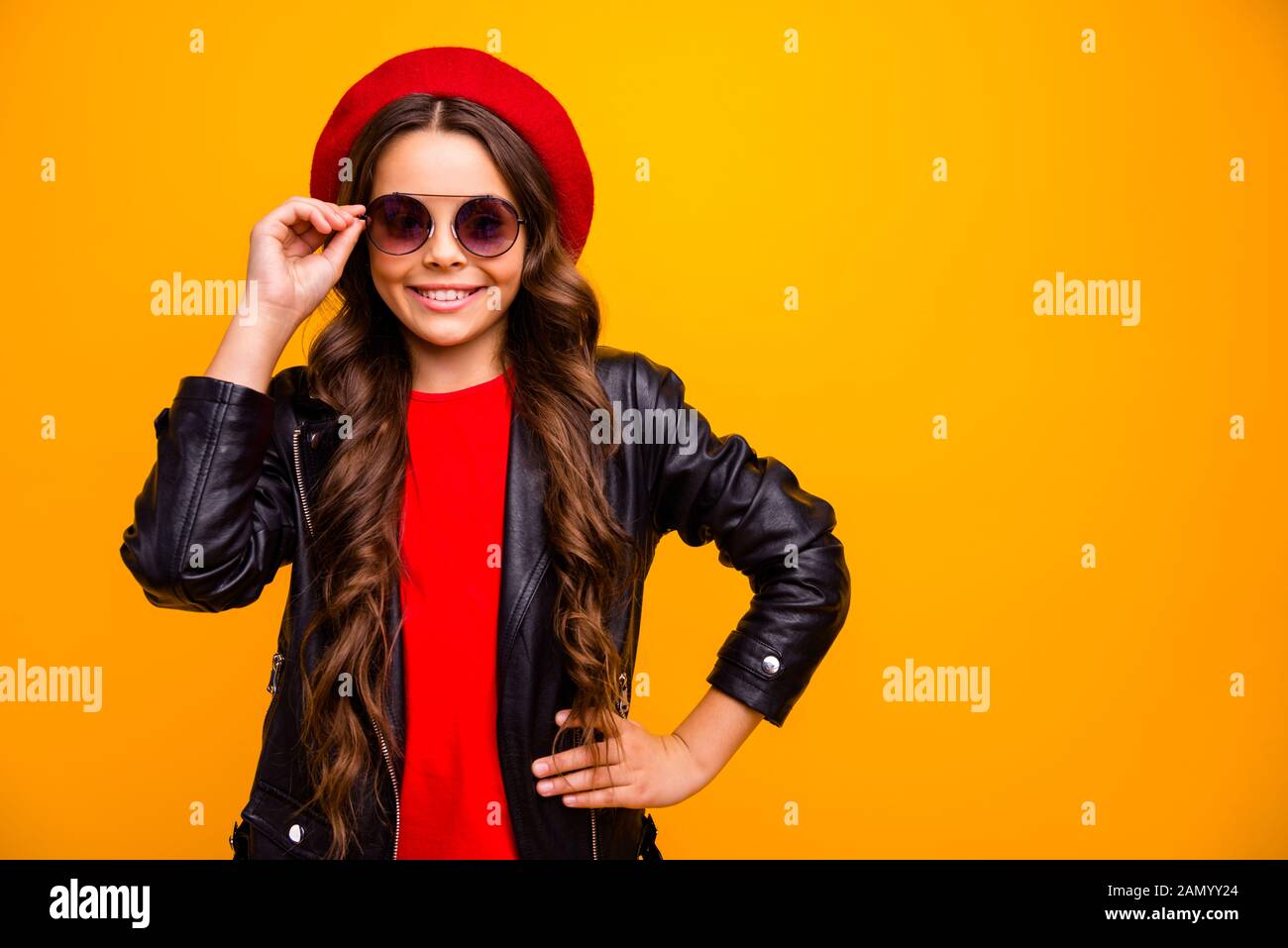 Close-up portrait of her she nice attractive charming lovely pretty fashionista cheerful cheery long-haired girl posing touching specs isolated over Stock Photo
