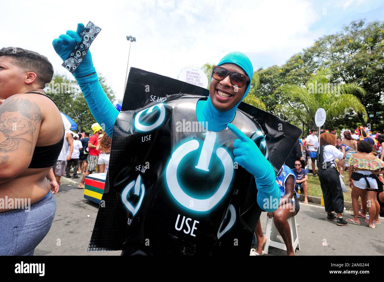 Street Carnival, South America, Brazil - March 4, 2019: A reveler dressed up like condoms performs during the Carnival in Rio de Janeiro. Stock Photo
