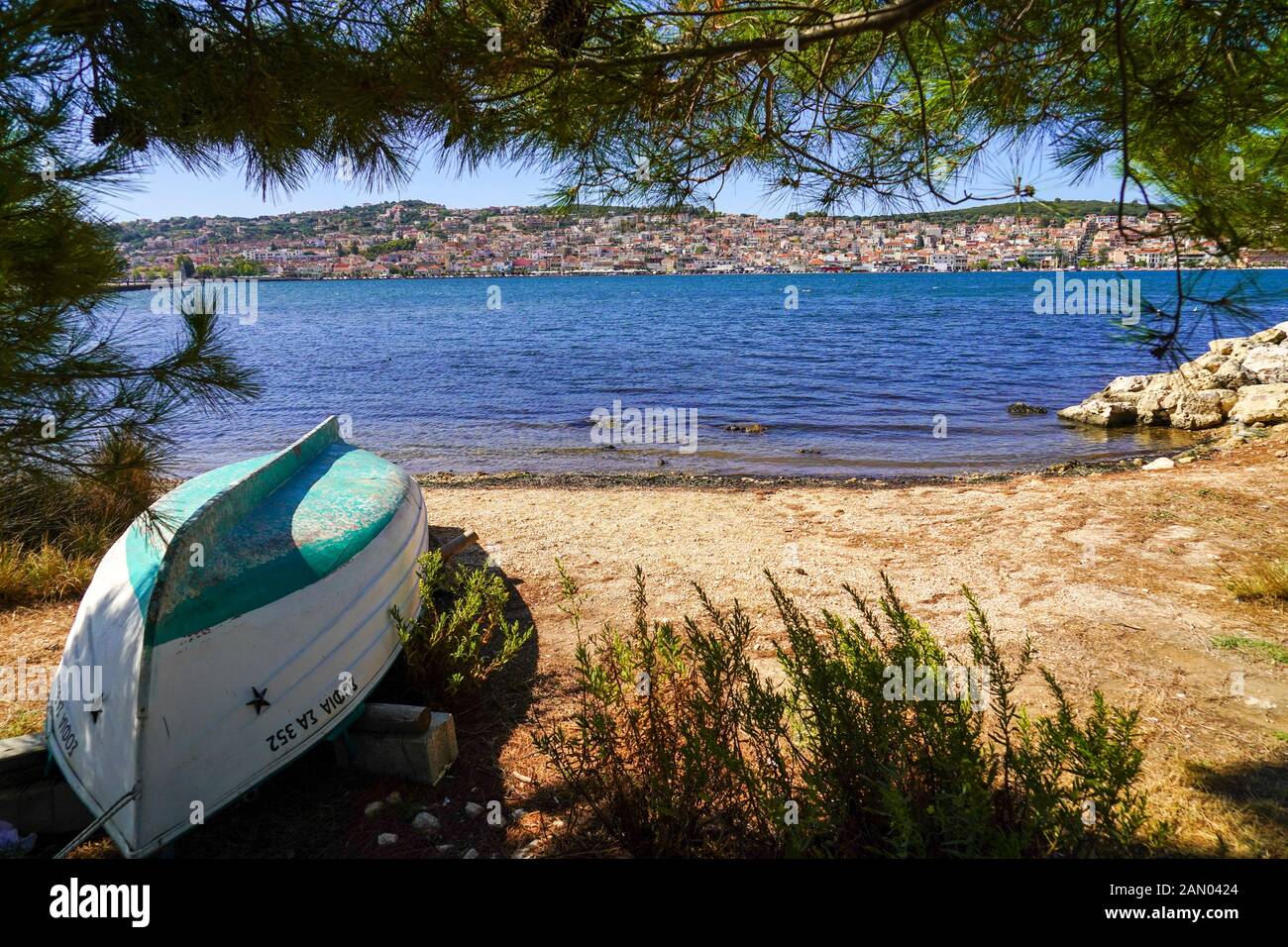 A deserted rowing boat on land Photographed on the Greek Island of Cephalonia, Ionian Sea, Greece Stock Photo