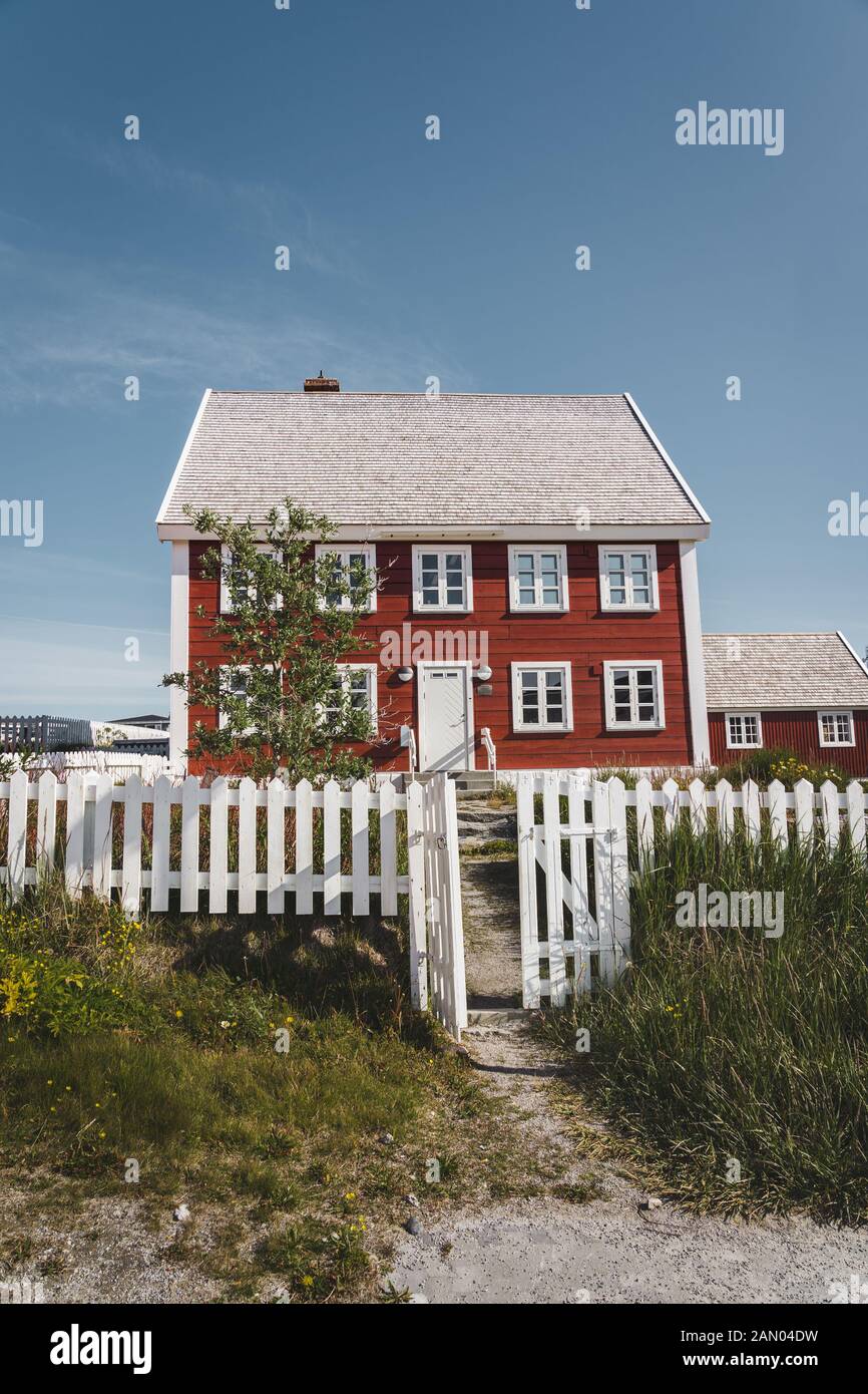 Nuuk city of Hanse Egede. Capital of Greenland. Colorful inuit houses in a suburb of arctic capital Nuuk. The old hospital - school at the waterfront Stock Photo