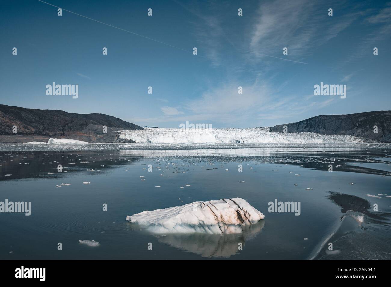 Greenland, Eqip Sermia, Eqi Glacier in Greenland Disko Bay. Boat trip in the morning over the arctic sea,Baffin Bay, calving glacier. Ice breaking of Stock Photo