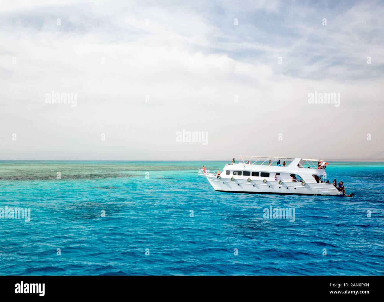 white cruise tourist boat on the background of the coast in the Red Sea ...