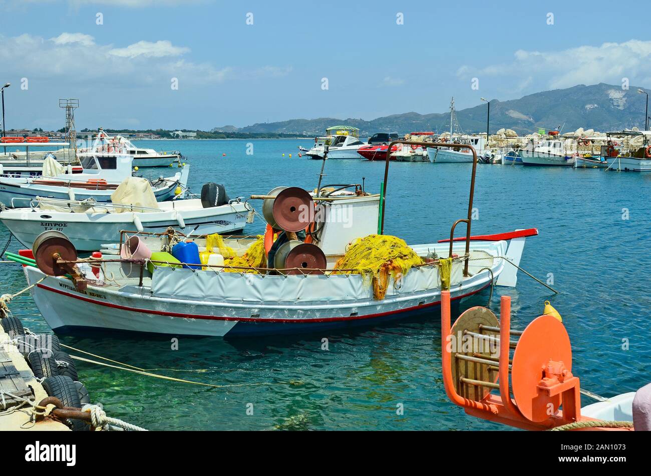 Zakynthos, Greece - May 24th 2016: tiny harbor with fishing boats in Agia Sostis on the greek island in Ionian sea Stock Photo